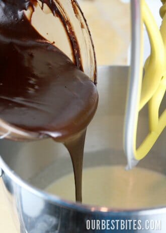 Adding melted chocolate to cake