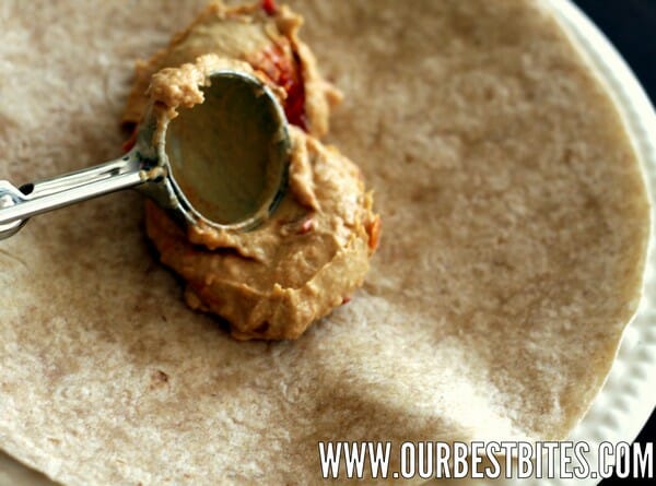 spreading hummus